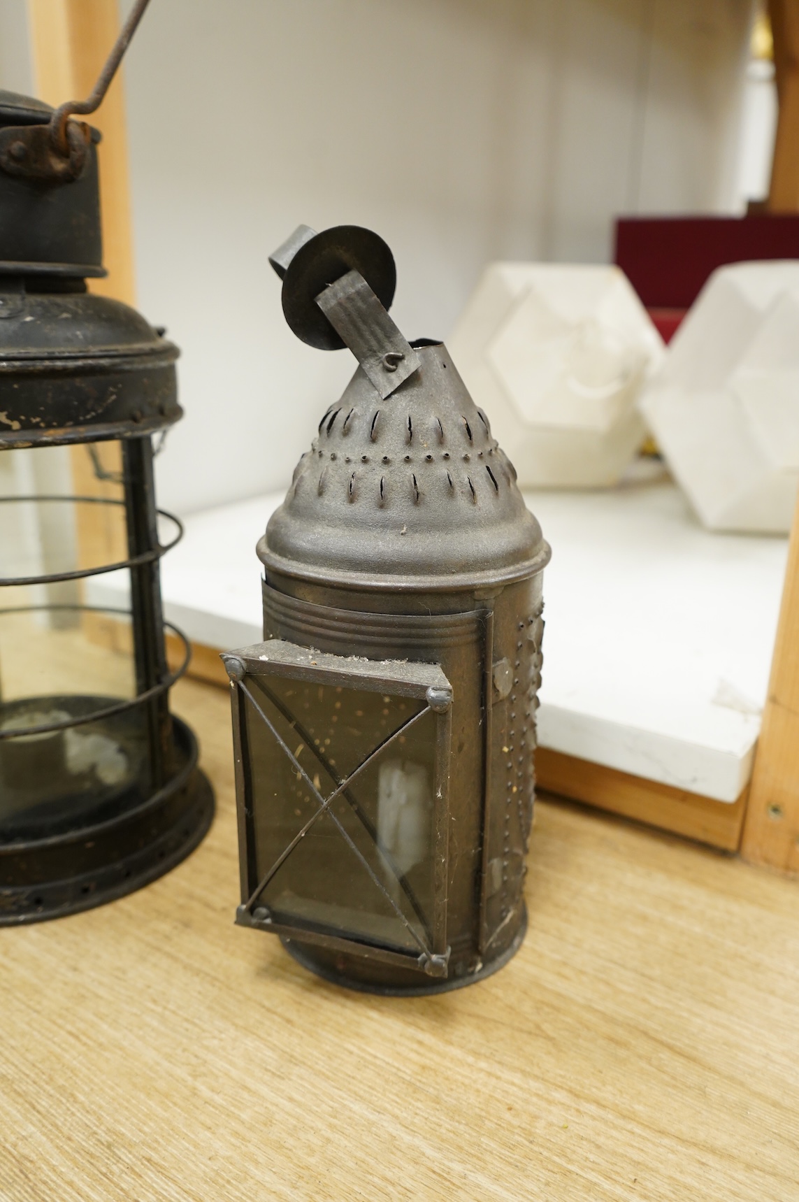 A pair of early 20th century railway hanging lanterns and one other, largest each 45cm high including swing handle